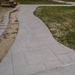 Stamped concrete sidewalk on a remodel in Saugatuck